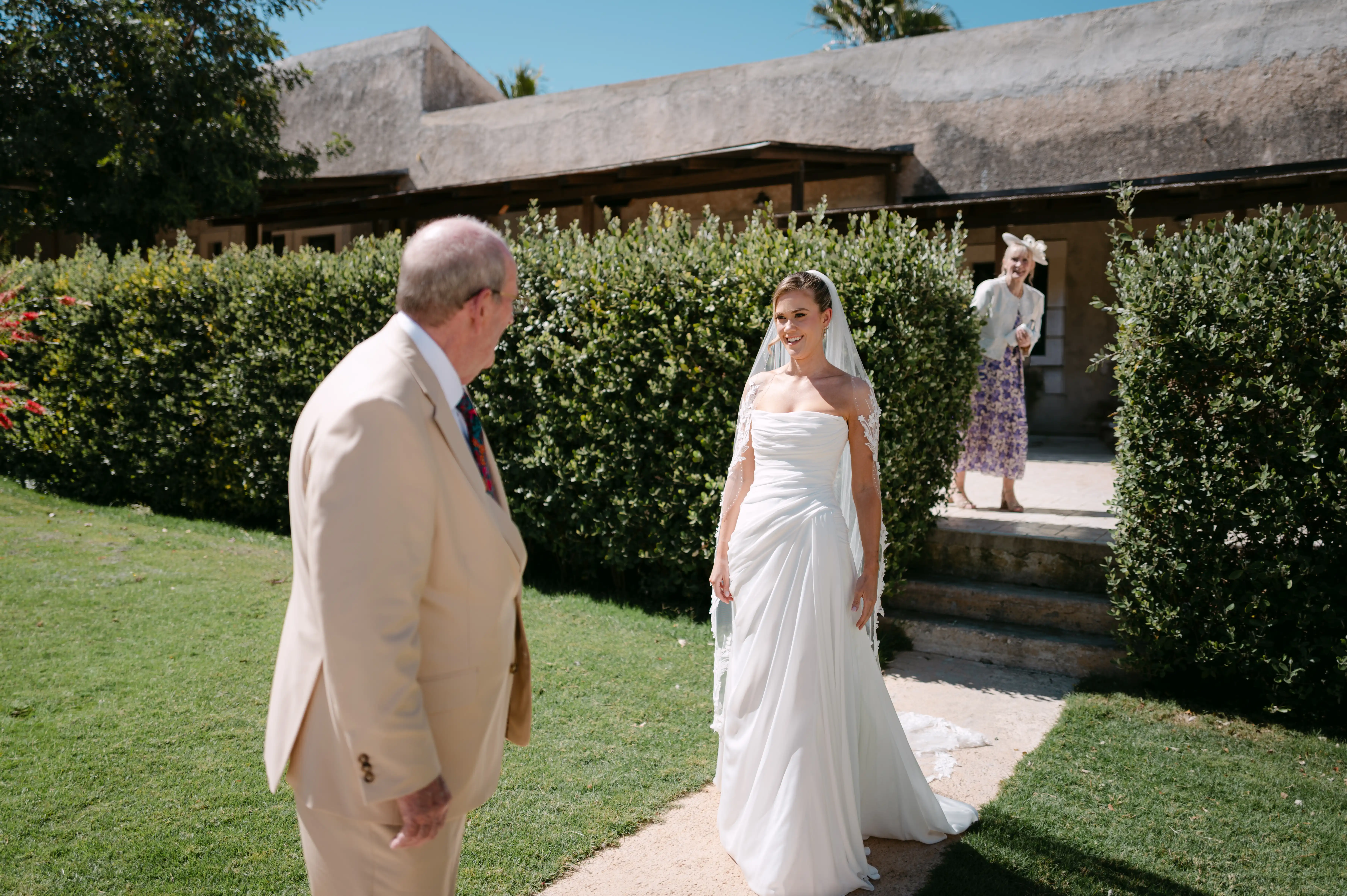 Emotional first look between bride and father at a Sicilian wedding venue